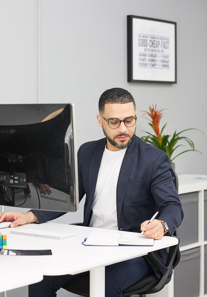 Licensed tax professional reviewing IRS documents at a desk